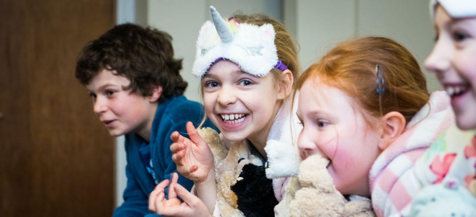Excited students enjoying overnight stay at school