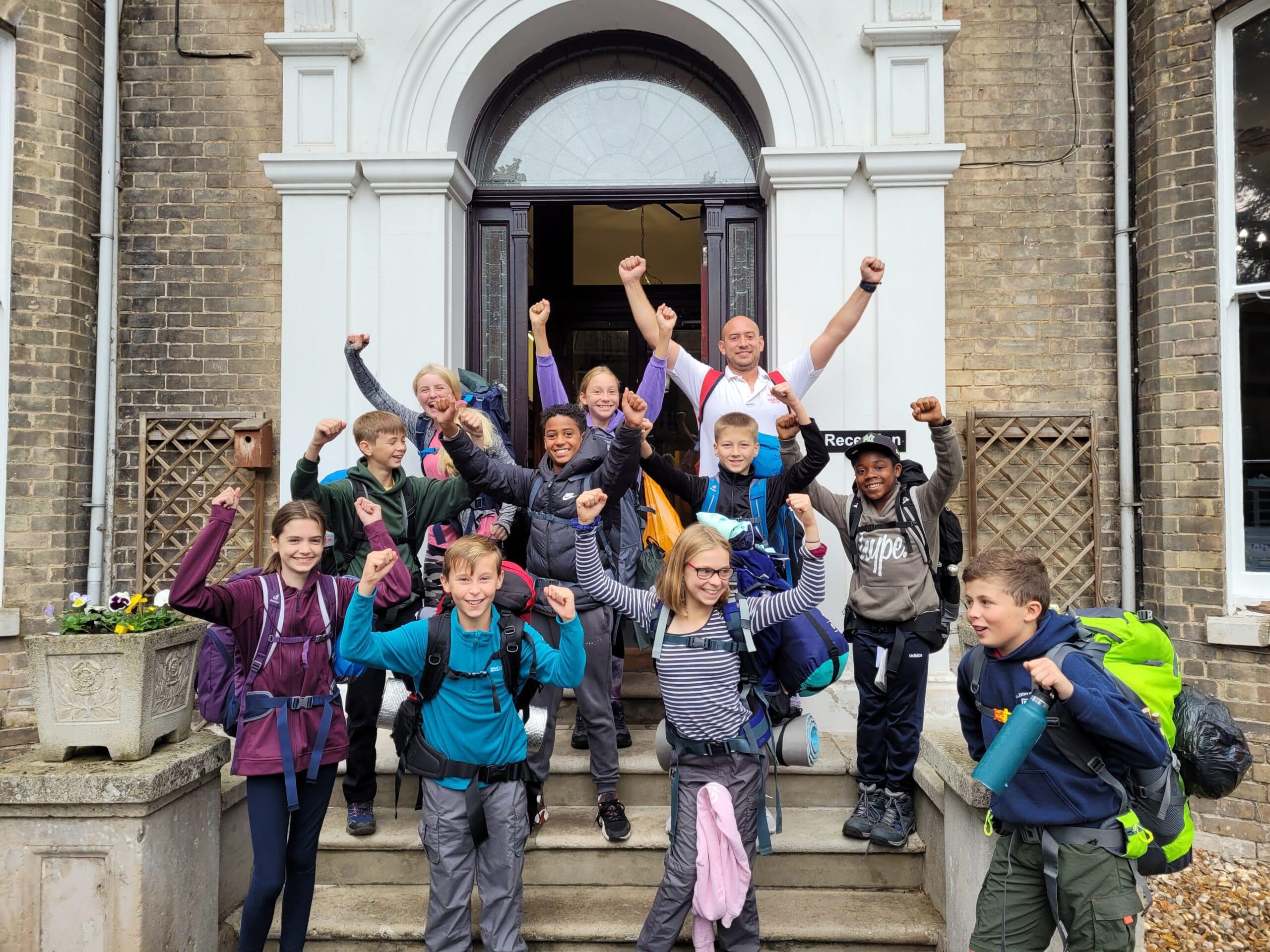 Group of camping students with their teacher