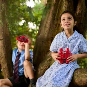 children using binoculars