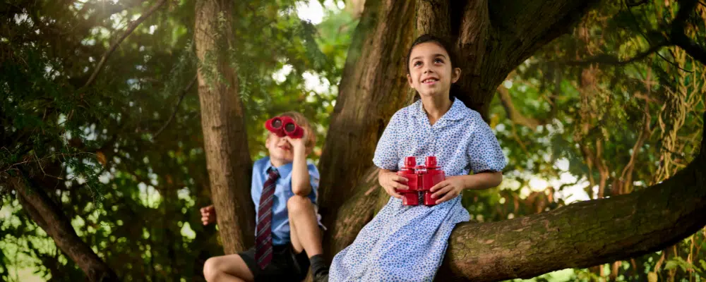 children using binoculars