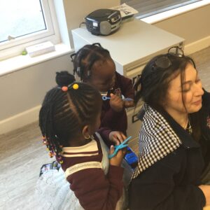 students playing with a person's hair