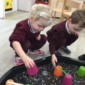 students getting immersed in sensory play