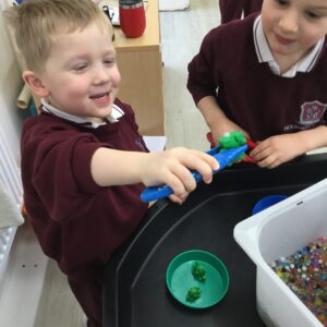 students getting immersed in sensory play