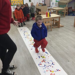 student walking over paint